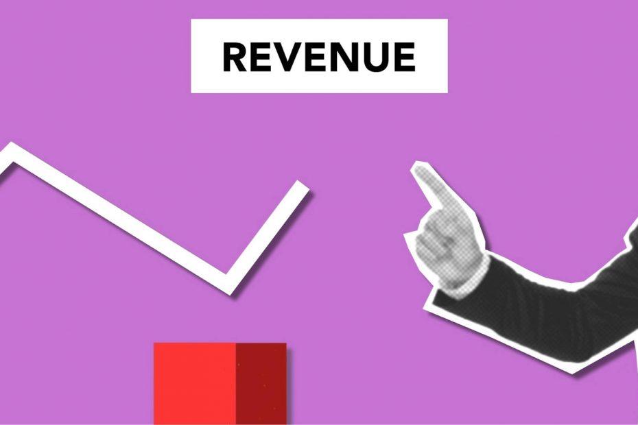 Business owner looking at chart showing increased revenue.